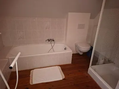 a bathroom with a white tub and a toilet at B&B Wepa-hof in Oud-Turnhout