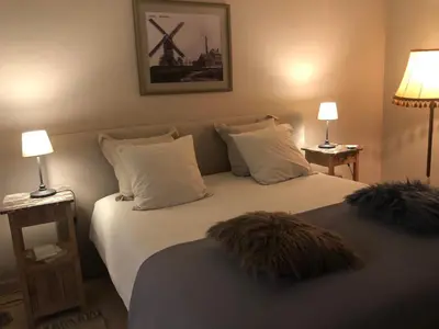 a bedroom with two beds with pillows and two lamps at NeNe in Dilbeek