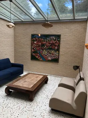 a living room with a couch and a coffee table at Belair Studio in Tervuren