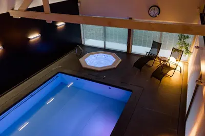 an overhead view of a swimming pool in a house at Lavendelhof luxe wellnesshouse in Zottegem