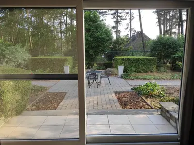 a view of a patio through a sliding glass door at Villa Chill in Scherpenheuvel-Zichem