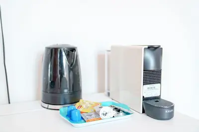 a coffee maker and a blender on a counter at Smart Appart - Gare Du Midi in Brussels