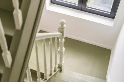 a stairway with a window and a stair case at Design Studio Gent nabij station, musea &centrum in Ghent