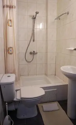 a bathroom with a toilet and a shower and a sink at Apartments Marco Polo Midi in Brussels