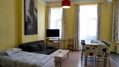 a living room with a couch and a table at Apartments Marco Polo Midi in Brussels