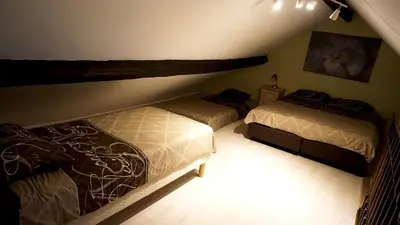 a bedroom with two beds in a attic at Apartments Marco Polo Midi in Brussels