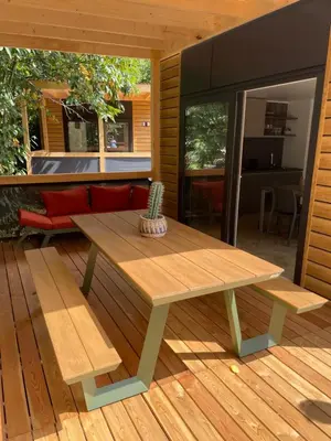 a wooden table and bench on a wooden deck at Urban Gardens Gent in Ghent