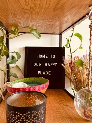 a sign that says home is our happy place with two bowls at Cozy two bedroom Apartment near city centre Gent in Ghent