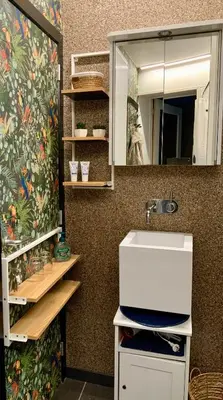 a bathroom with a sink and a mirror at Freetimeflat Mies & Fien in Ghent