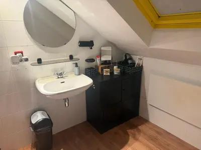 a bathroom with a sink and a mirror at Perk25A in Steenokkerzeel