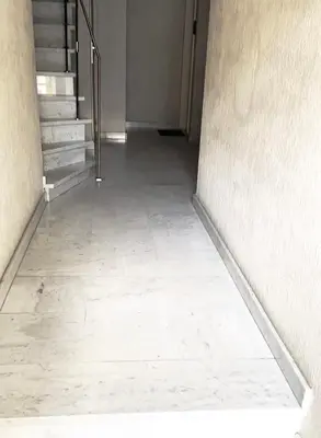 an empty hallway with stairs and a stair case at Luxe apt with parking & garden in wilrijk antwerp in Antwerp