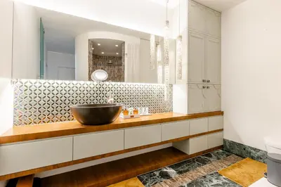 a bathroom with a sink and a mirror at Luxe apt with parking & garden in wilrijk antwerp in Antwerp