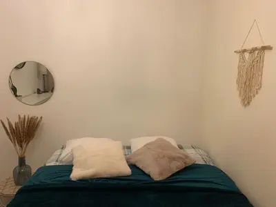 a bedroom with a bed with two pillows on it at Vintage dream in Heide
