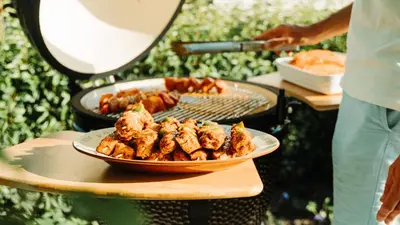 a plate of food on a table with a grill at B&B De Tiendeschuur in Evergem