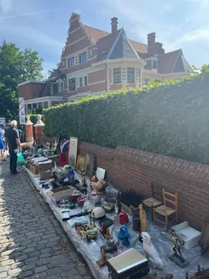 a pile of toys on a table in front of a house at Rooftop terrace suite in Heist-op-den-Berg