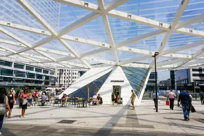 a large white building with people walking around it at Hote Brussels center City luxe Tours et Taxi in Brussels