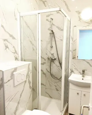 a bathroom with a shower and a sink at Benny's Rooms Brussels City Centre in Brussels