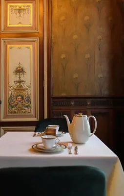 a table with a tea pot and cups on it at Huis Dujardin Bed&Breakfast in Antwerp