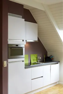 a kitchen with white cabinets and a sink at B2B-flats in Ternat