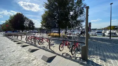 a row of bikes parked next to a rail at Oneluxstay Antwerp City Centre in Antwerp