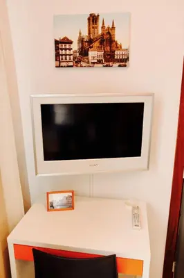 a flat screen tv hanging on a wall at B&B Allegra Nova in Ghent