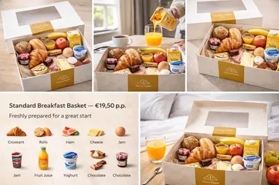 a box of breakfast baskets with breakfast foods and orange juice at Sabi Stay Antwerp in Antwerp