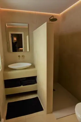 a bathroom with a sink and a mirror at Sabi Stay Antwerp in Antwerp