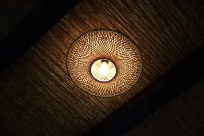 a light on top of a wooden table at Sabi Stay Antwerp in Antwerp