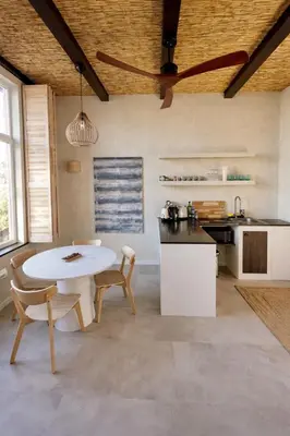 a kitchen with a table and chairs in a room at Sabi Stay Antwerp in Antwerp