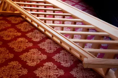 a wooden staircase in a room with a red carpet at B&B Hippo-Droom in Hoeilaart