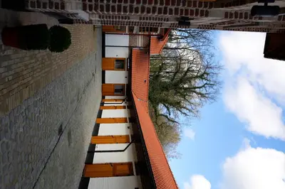 a tall brick building with a view of the sky at B&B Hippo-Droom in Hoeilaart