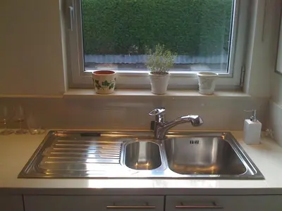a sink in a kitchen with a window at Holiday Home and Office Domisi'l in Wachtebeke