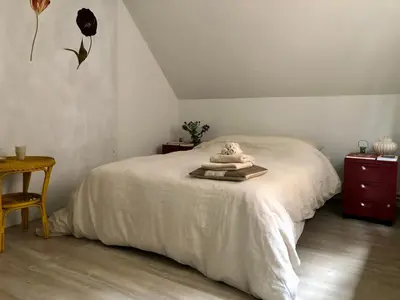 a bedroom with a white bed with a towel on it at Giorgio in Antwerp
