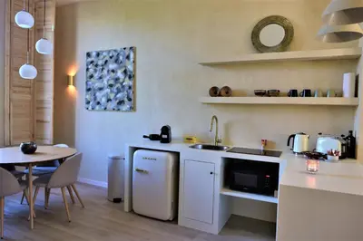 a kitchen with a sink and a table with a tableablish at Japandi Apartment, Cityview Elevator in Antwerp