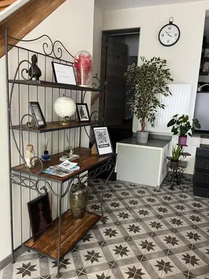 a room with a table and a floor with stars at Au Marolles chambre Atomium in Brussels