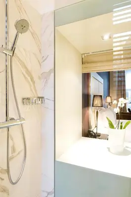a bathroom with a shower and a mirror at Apartment Nyhuset in Brussels