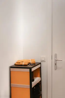 a table with towels on it next to a door at Apartment The City in Ghent