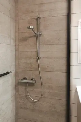 a shower with a shower head in a bathroom at Apartment The City in Ghent