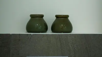 two green vases sitting on top of a shelf at LUXURY LUMINOUS 2bedroom apt CENTER of BRUSSELS in Brussels
