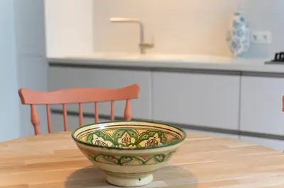 a bowl sitting on top of a table in a kitchen at SHWAY - The Saffron Dress in Antwerp