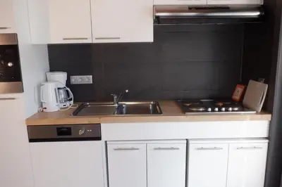 a kitchen with a sink and a counter top at Hoeve Megusta in Vlimmeren