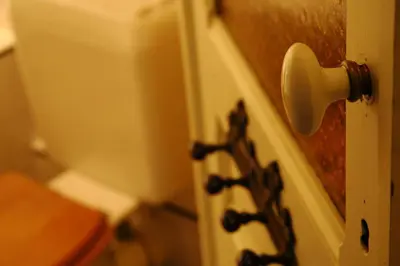 a close up of a door with a knob at Villa des Roses Voltaire in Brussels