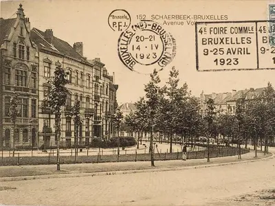 an old photo of a building with a clock on it at Villa des Roses Voltaire in Brussels