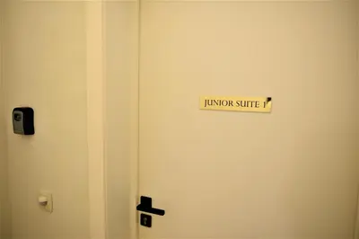 a door with a sign that reads lunch service at Modern apartment with terrace at Theaterplein in Antwerp