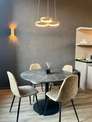 a dining room with a table and chairs at Modern apartment with terrace at Theaterplein in Antwerp