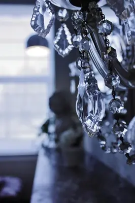 a close up of a chandelier with crystals at B&B Avenue Deschanel in Brussels