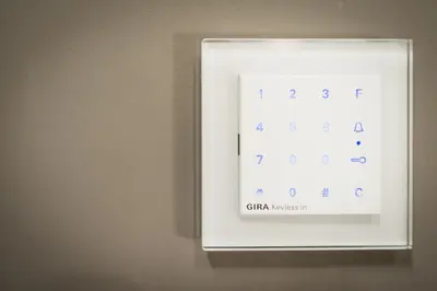 a lightswitch on a wall with a clock on it at B&B Avenue Deschanel in Brussels