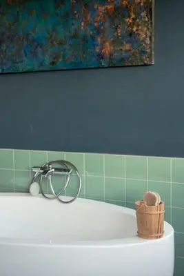 a bath tub with a basket on top of it at Mari's: Multifunctional Shelter with big Garden in Ghent
