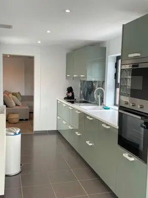 a kitchen with a sink and a stove top oven at Cosy flat for 4 p. with garden in Tremelo in Tremelo
