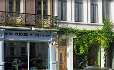 a building with a sign that reads mrs raker schoolstay at OneLuxStay near Fashion District in Antwerp